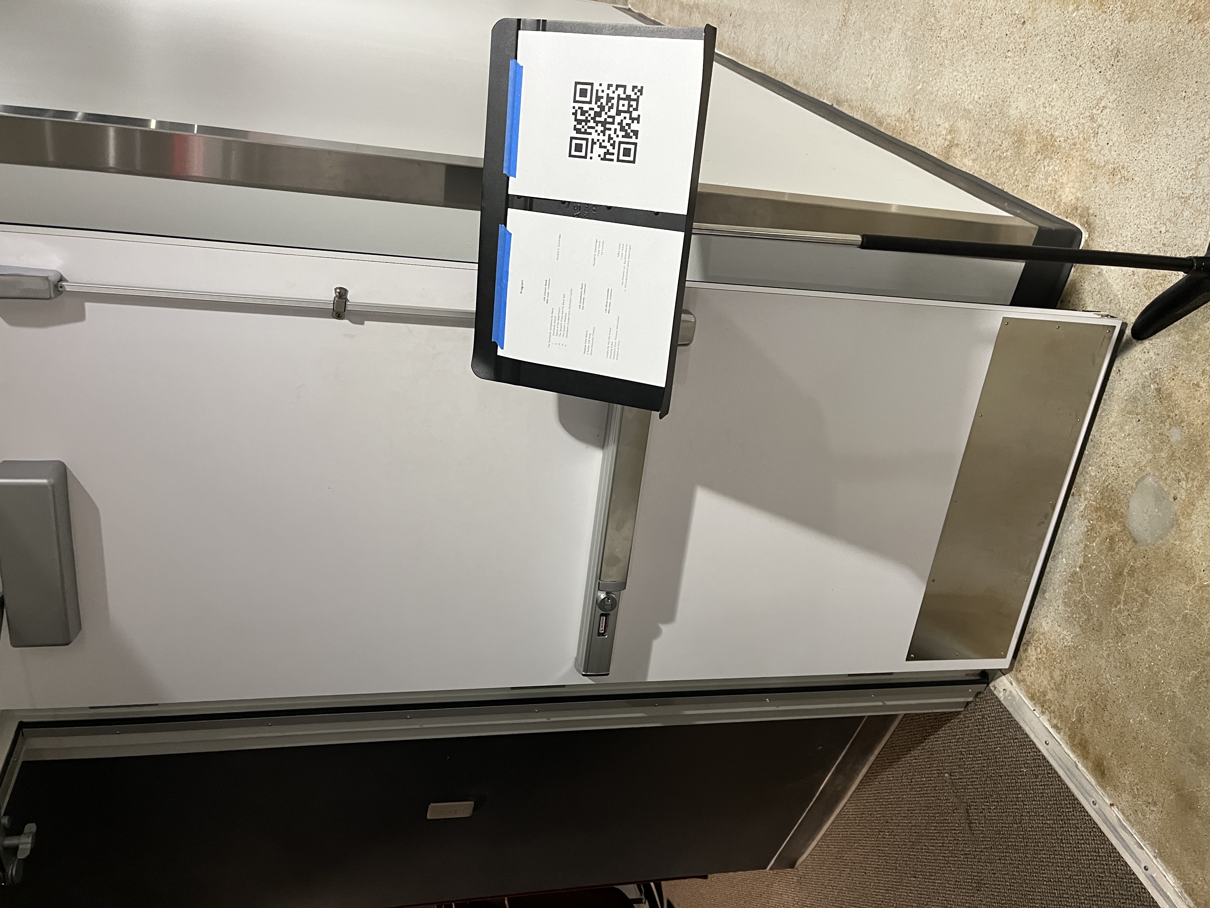 QR code posted on a door for a concert program